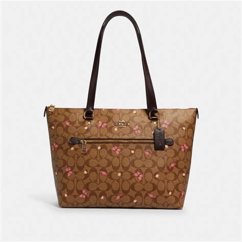 coach gallery tote in signature canvas with butterfly print|gallery tote with coach heritage.